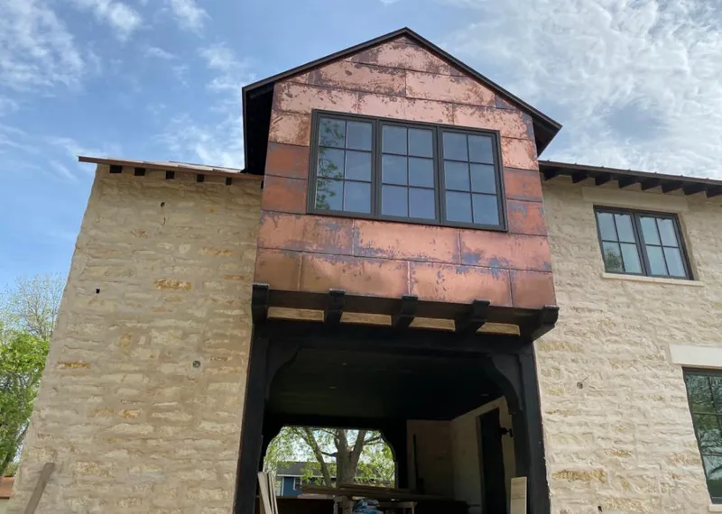 Copper metal panel facade on a stone building for Skylight Installation in Crawfordsville